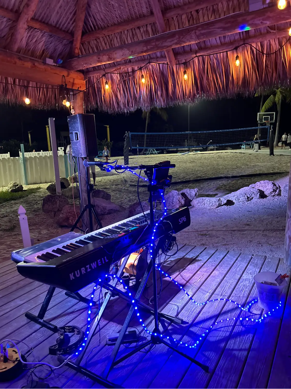 Keyboard set up on stage at night